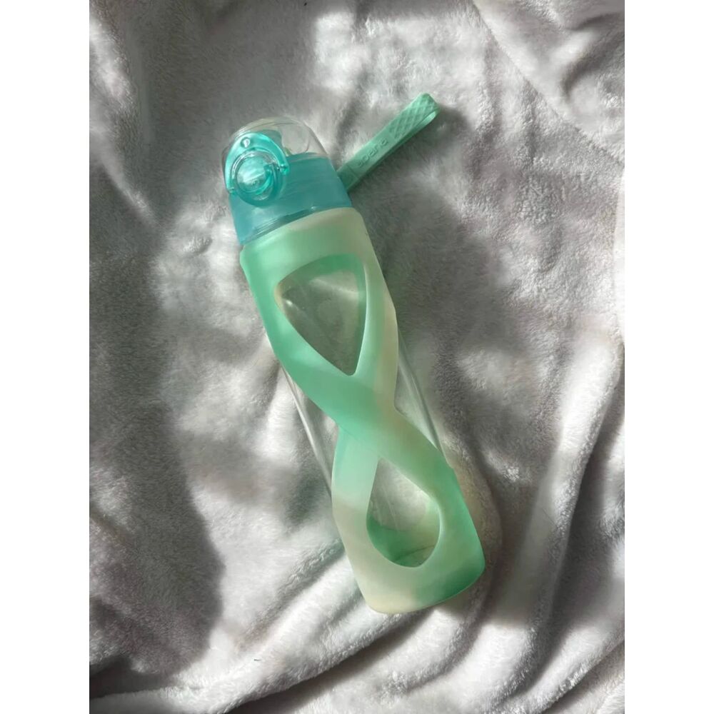 glass water bottle with rubber grip and handle | apana reusable bottle